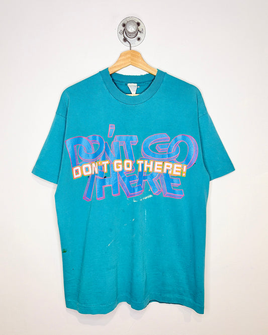 Vintage 90s Distressed “Don’t Go There” Teal Tee Shirt
